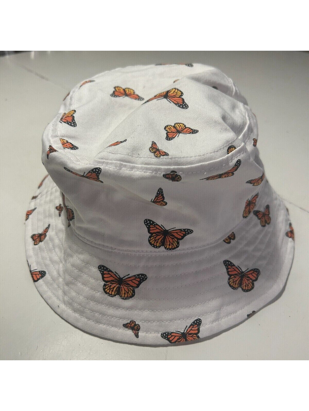 White Bokeh Monarch Butterfly Bucket Hat